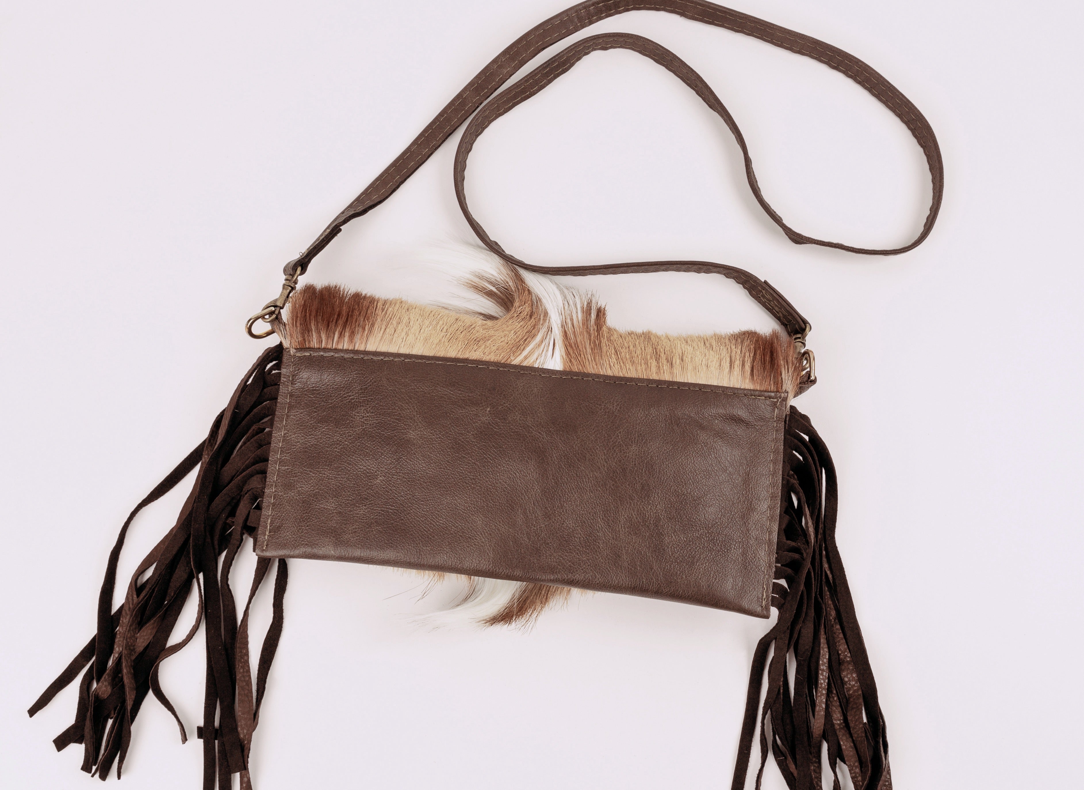 Springbok flap with brown leather Crossbody strap.