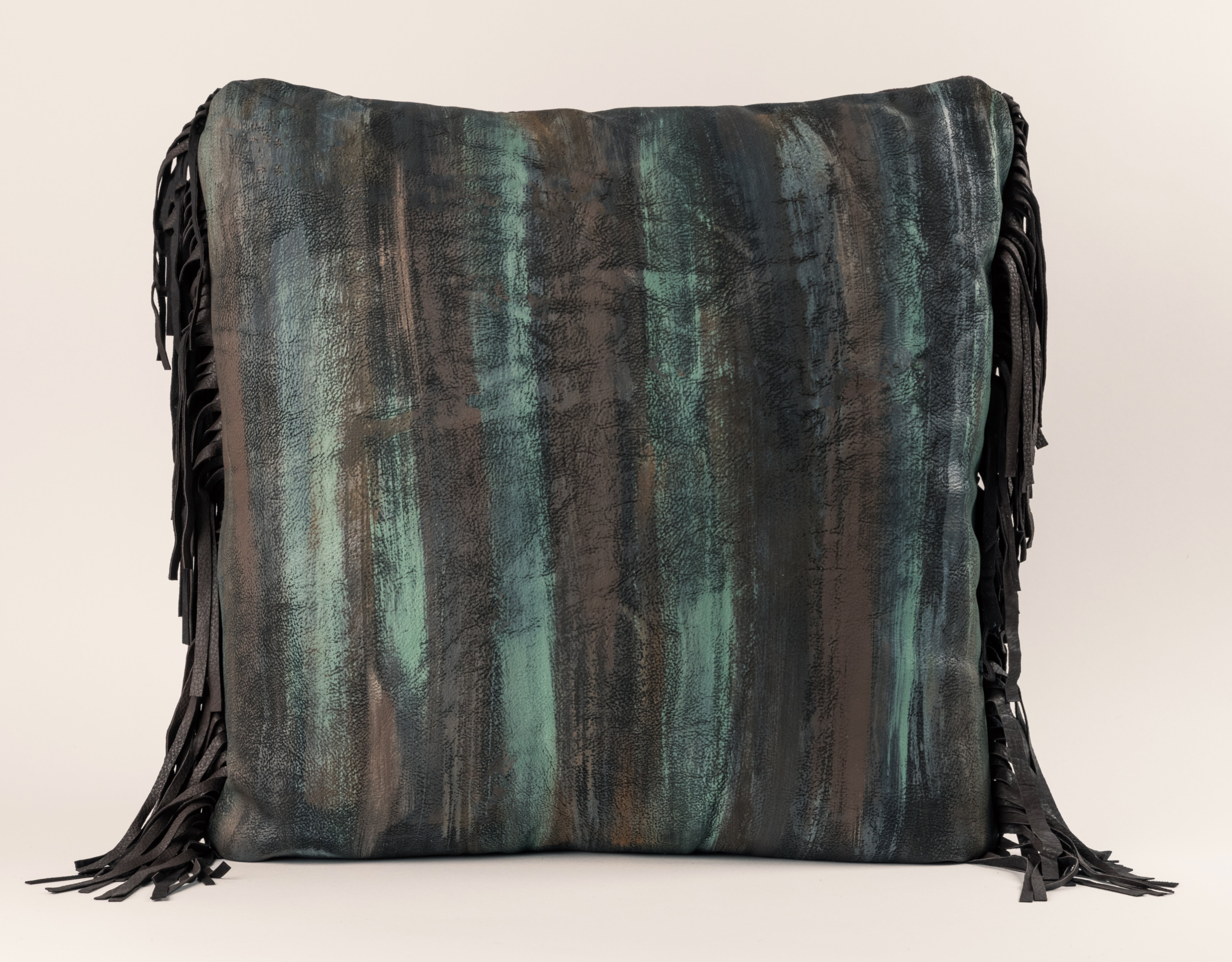 Hand painted patina leather front with black fringe on the back
